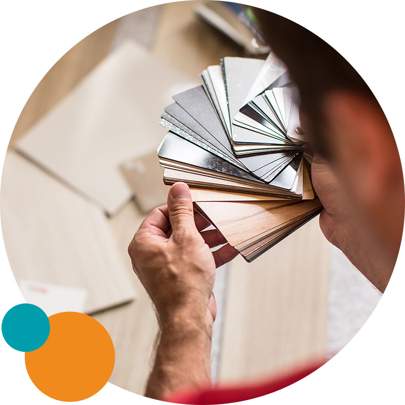 person looking at paint swatches