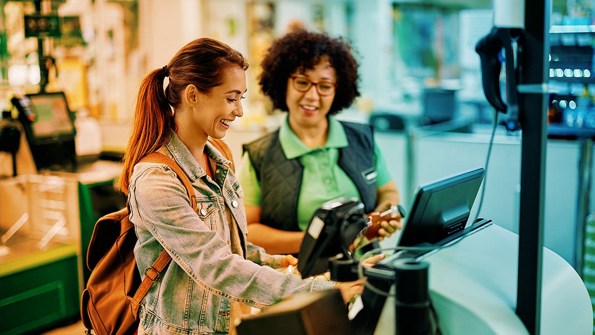 Happy customer being helped at checkout