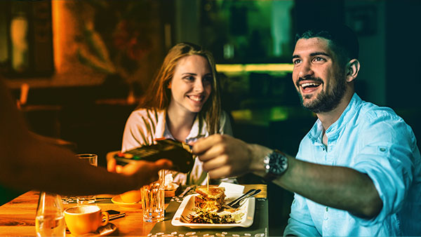 customers paying at a restaurant